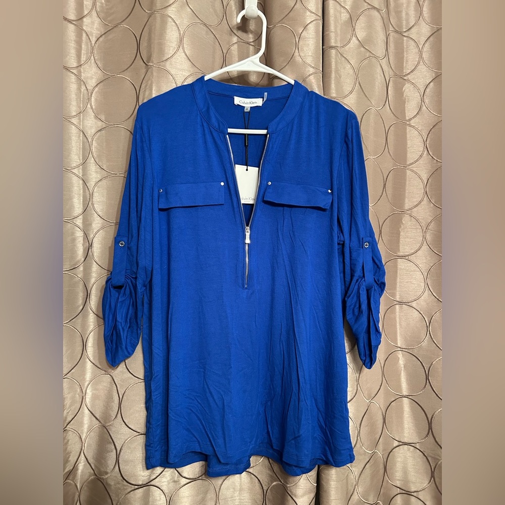 Brand new Calvin Klein half zip, rolled sleeves blouse. Size 0X